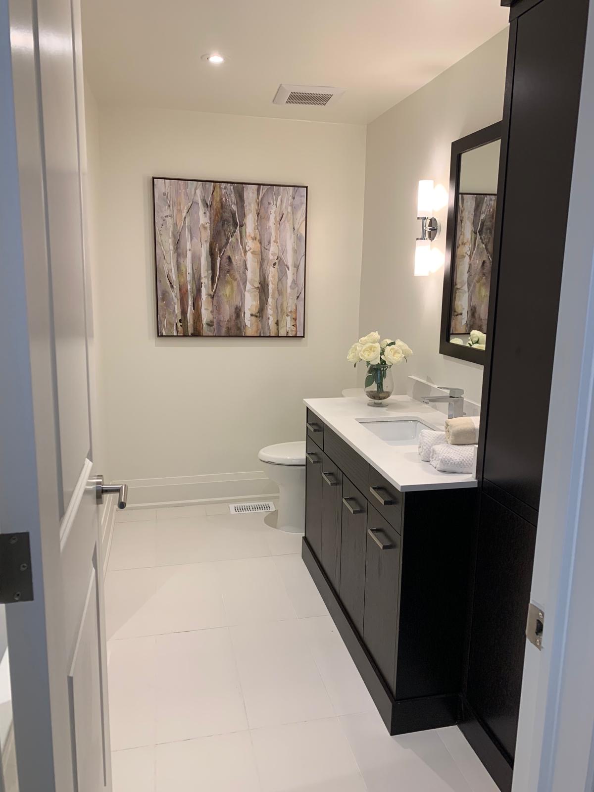 Bathroom vanity area with crisp paint finish