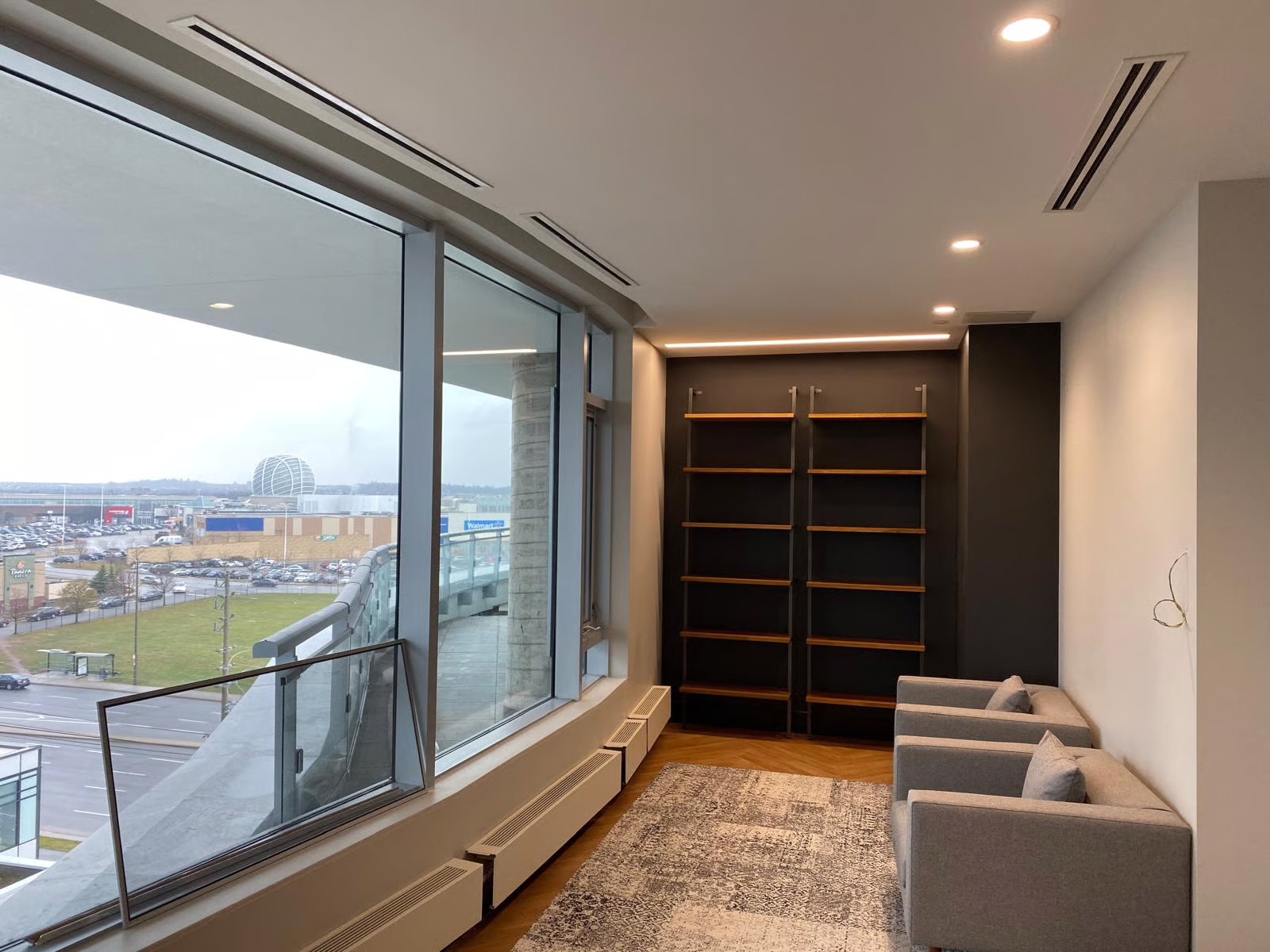 Residential lounge space with built-ins and clean walls